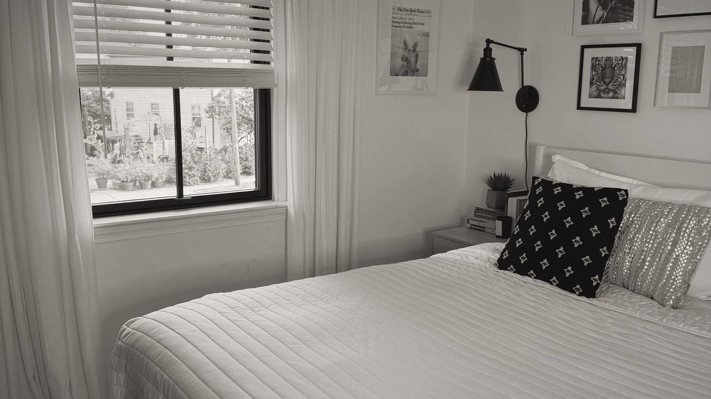 The bedroom window where the show is recorded, in black and white